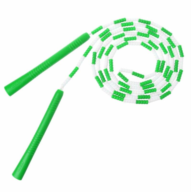 Children And Adults Skipping Rope
